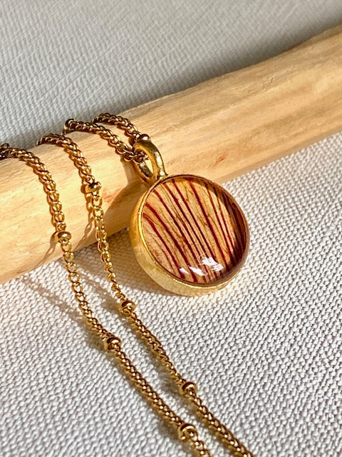 Gold plated pendant with beautiful detail of the Trumpet flower.