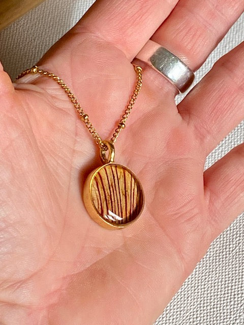 Gold plated pendant with beautiful detail of the Trumpet flower.