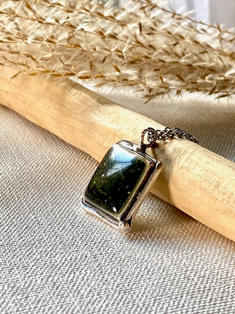 Silver-plated square pendant filled with dark green real moss.