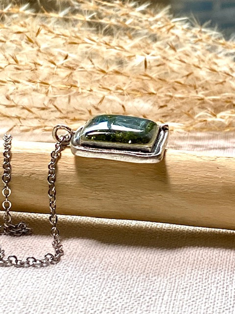 Silver-plated square pendant filled with dark green real moss.