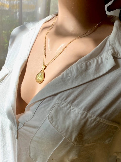 Dried Clover Flower in a gold plated drop pendant