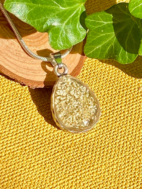 handmade nature inspired pendant with real flower 