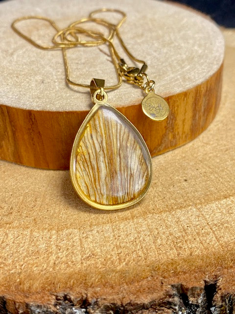 Drop-shaped pendant with dried leaves of the yellow Lily - color: gold