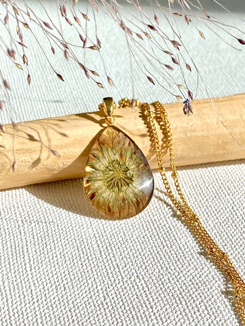 Dried Clover Flower in a gold plated drop pendant