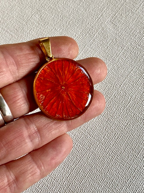 pendant with orange leaf