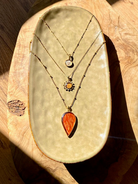 Flower pendant with real trumpet flower.