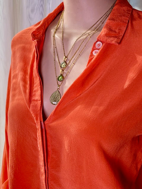 Beige seed with striped pattern in pendant